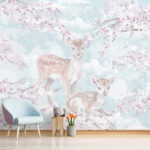 Papel de parede Corças no meio de flores em tons pastel.