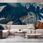 Papel de parede Folhas tropicais num fundo azul-petróleo.