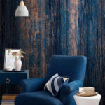 Papel de parede Padrão texturado em azul e bronze.