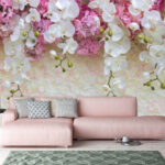Papel de parede Orquídeas em cascata sobre flores cor-de-rosa.