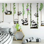Papel de parede Grupo de pandas em baloiços