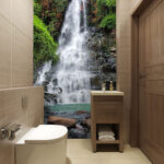 Papel de parede Majestosa cascata no meio de uma vegetação luxuriante.