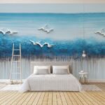 Papel de parede Pintura de pássaros a voar sobre um oceano azul